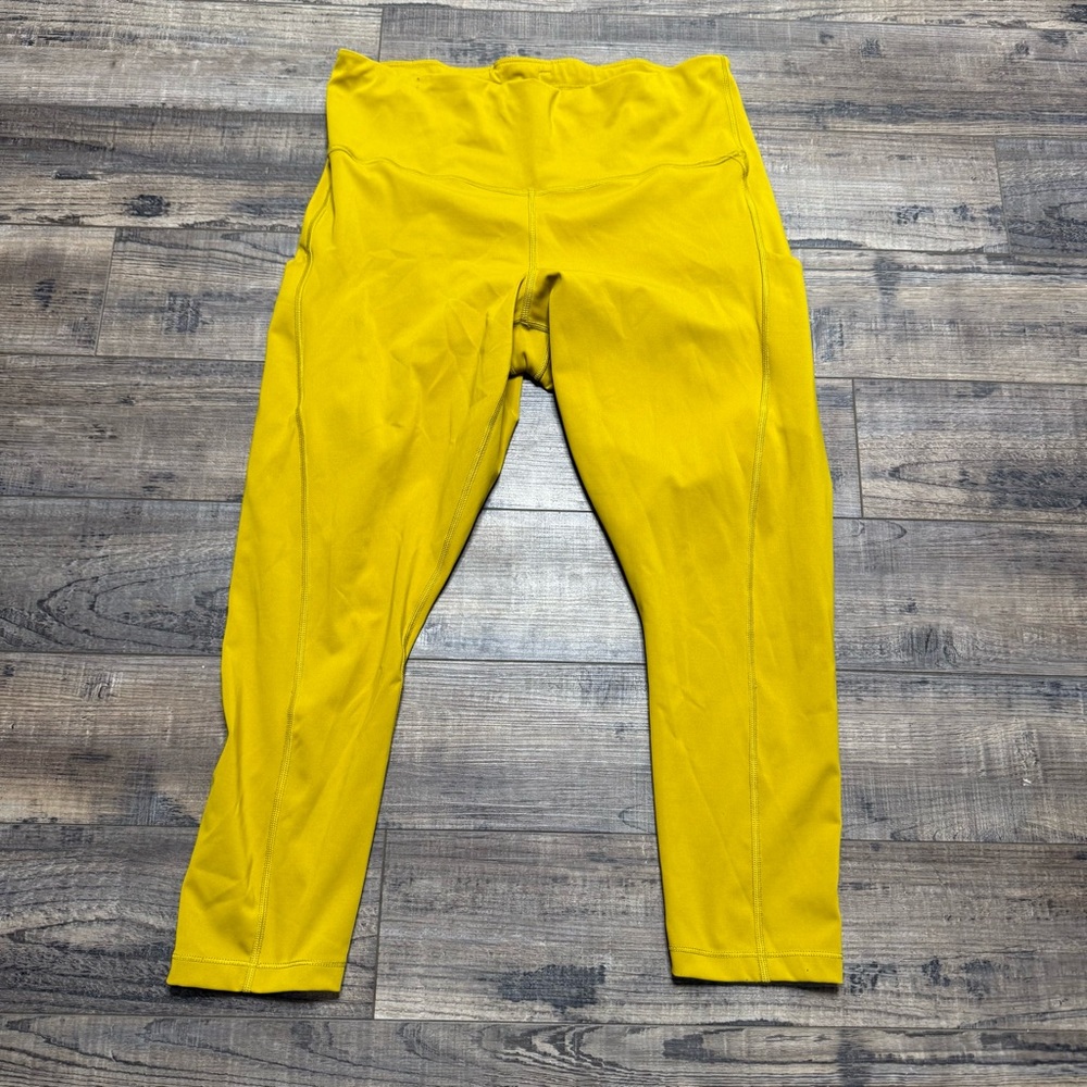 Athleta Ultimate Stash Pocket 7/8 Tights Leggings  Leggings in Vibrant Yellow